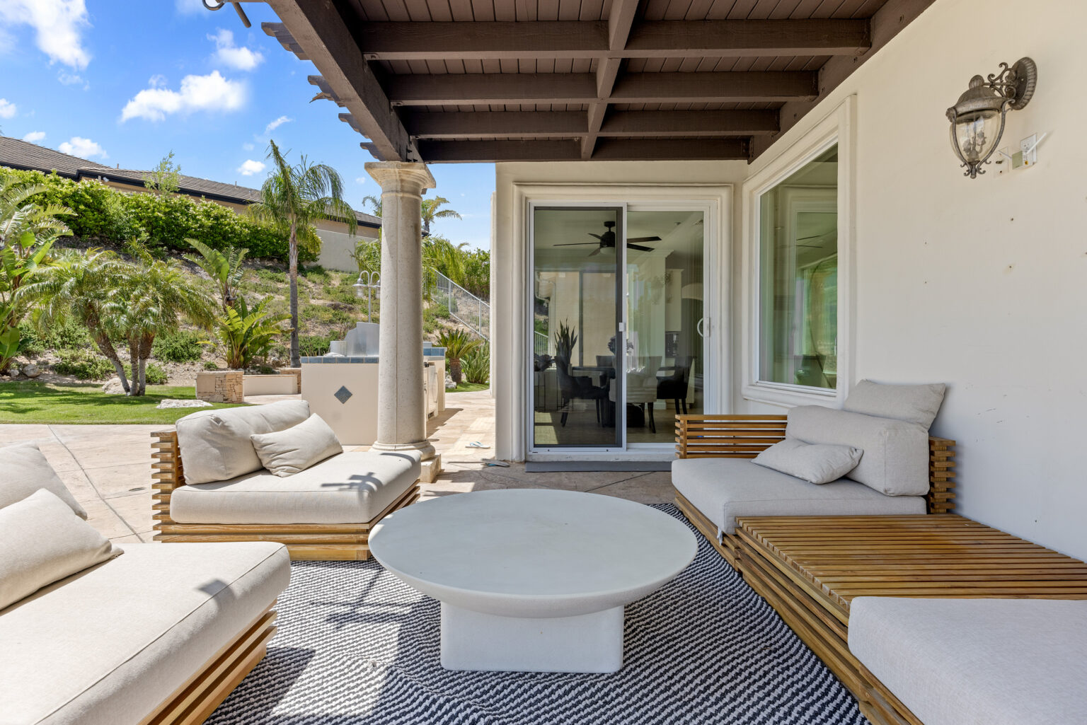 Covered outdoor lounge, LA backyard space.