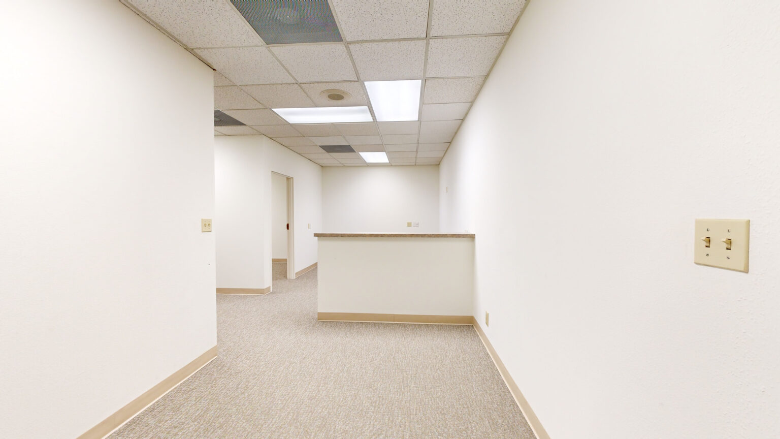 Empty white office interior with wood flooring