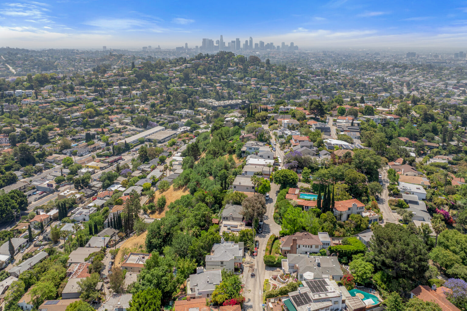 Aerial view from a drone of Los Angeles neighborhood skyline, real estate photography.