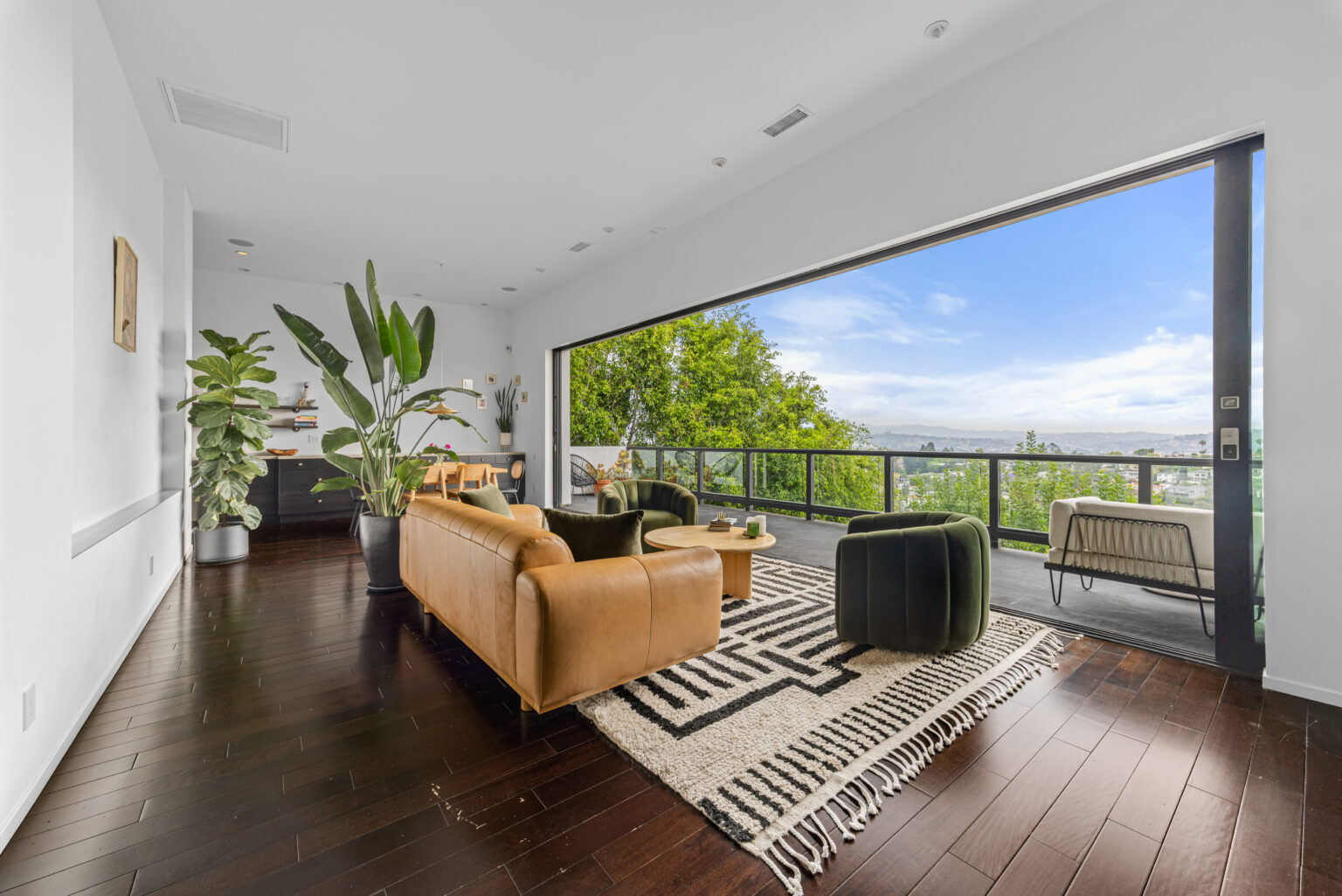 Open balcony lounge with views, modern LA listing.