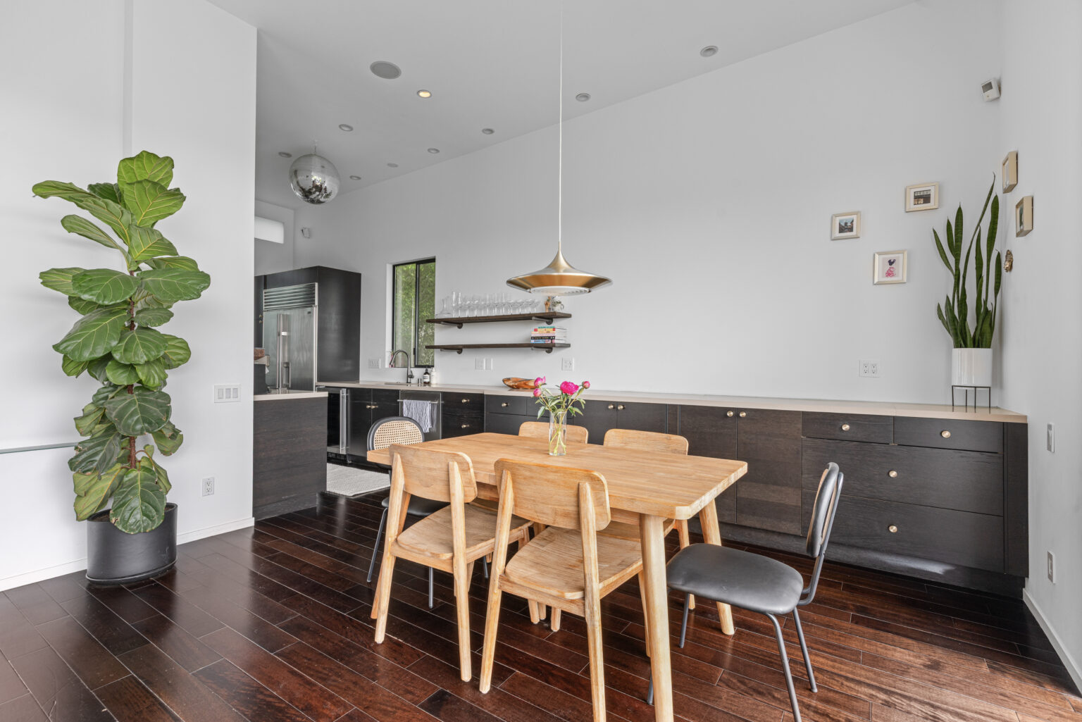 Wooden dining set in modern kitchen, Los Angeles home.