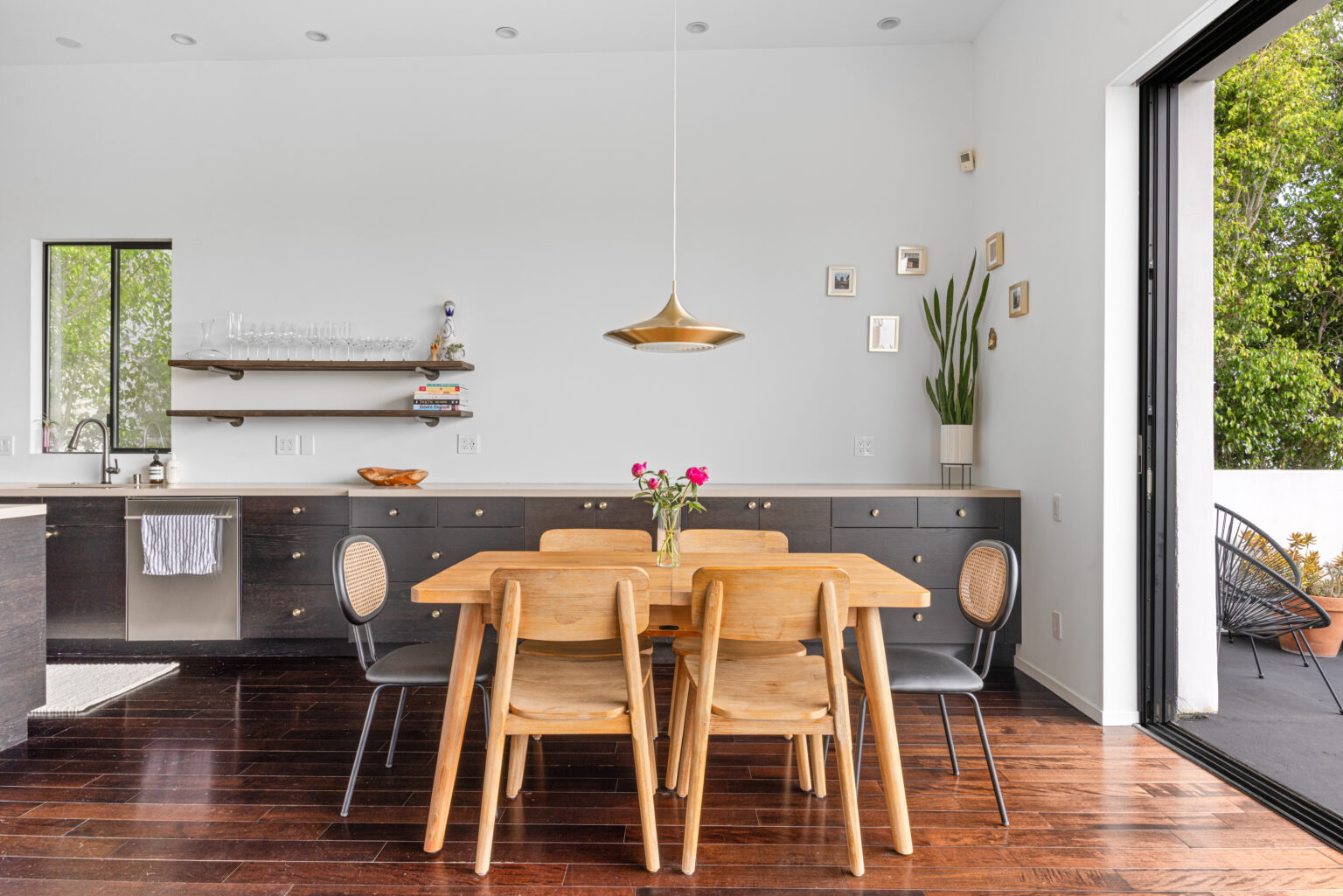 Kitchen dining corner with flowers and shelves, staged by L.A. REP.