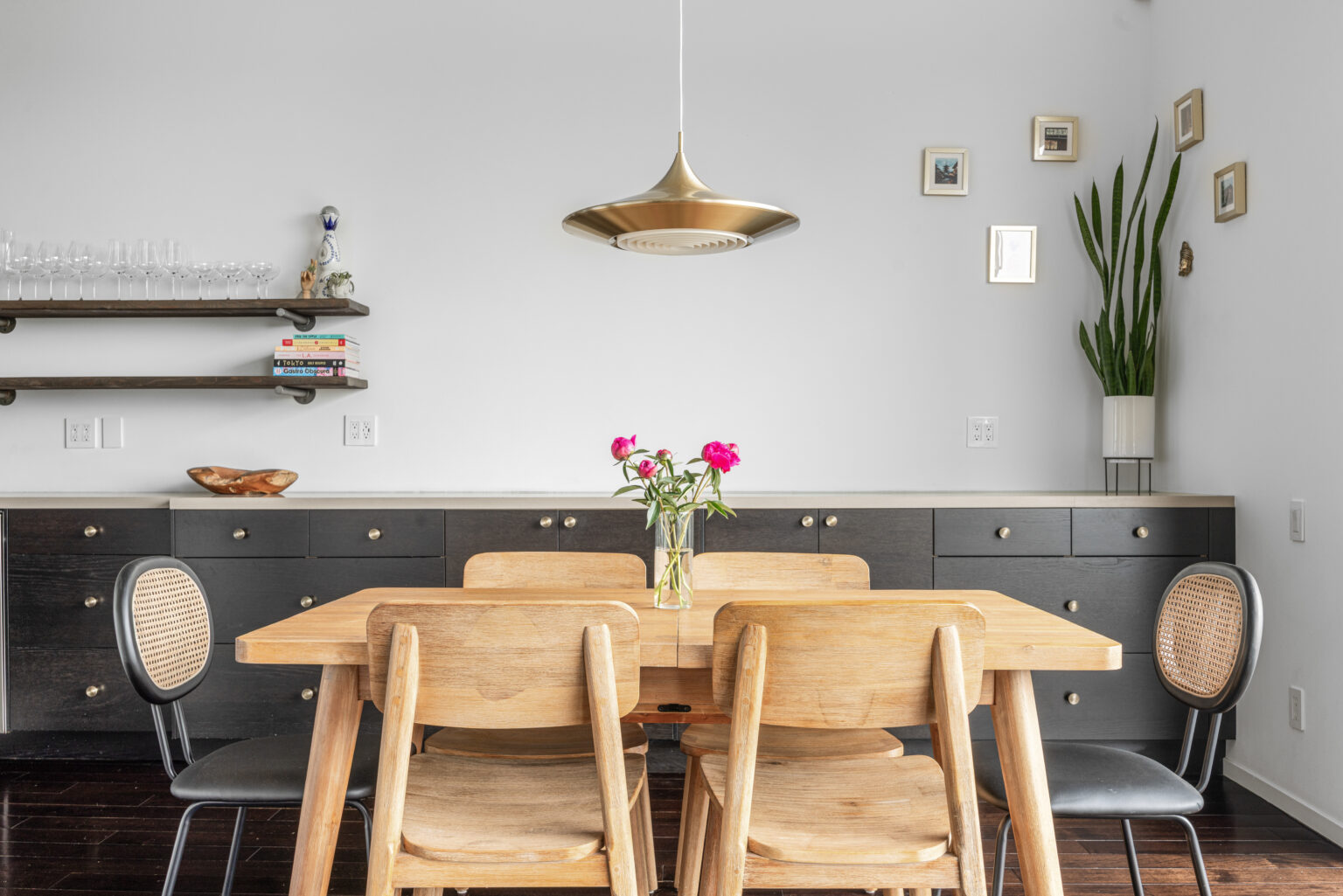 Dining area with large windows and balcony views, Southern California.