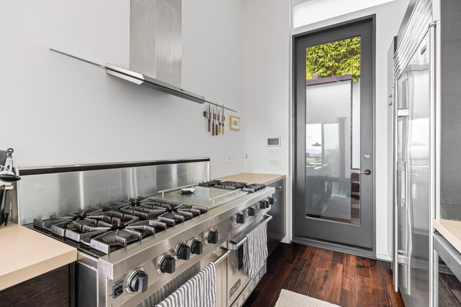 Gourmet kitchen with stainless appliances, LA listing photo.