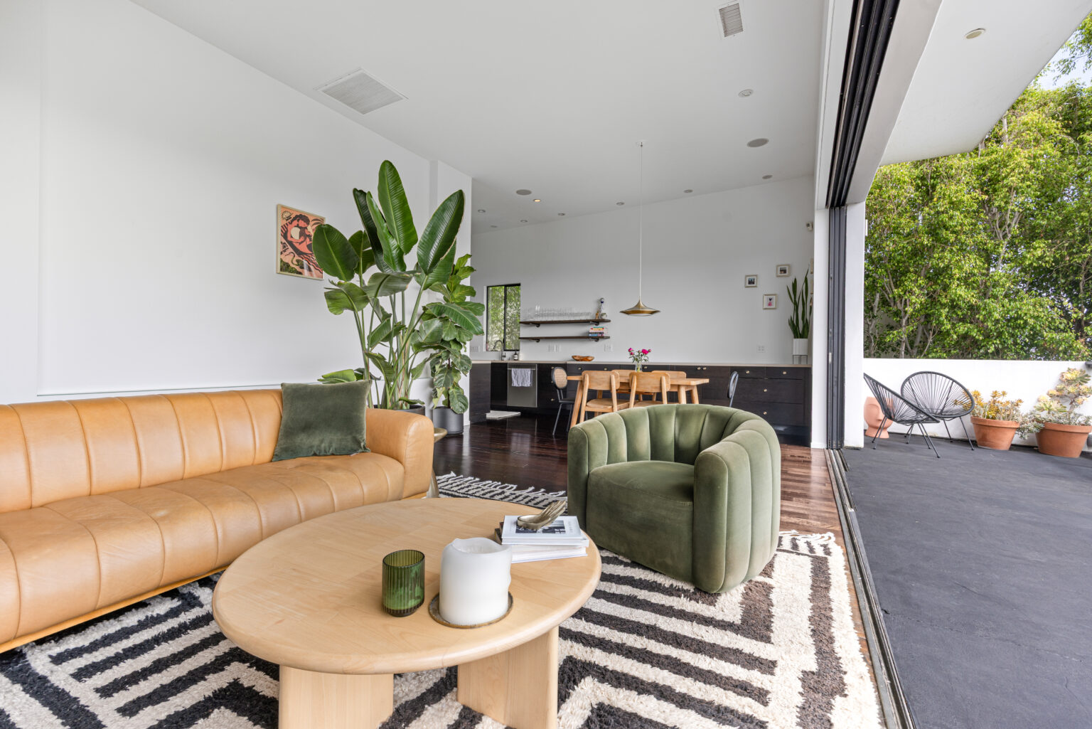 Cozy living area with sofa and greenery, staged by L.A. REP in Los Angeles.