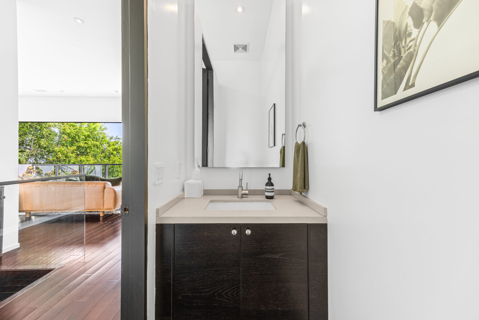 guest powder room with modern sink, staged by L.A. REP.