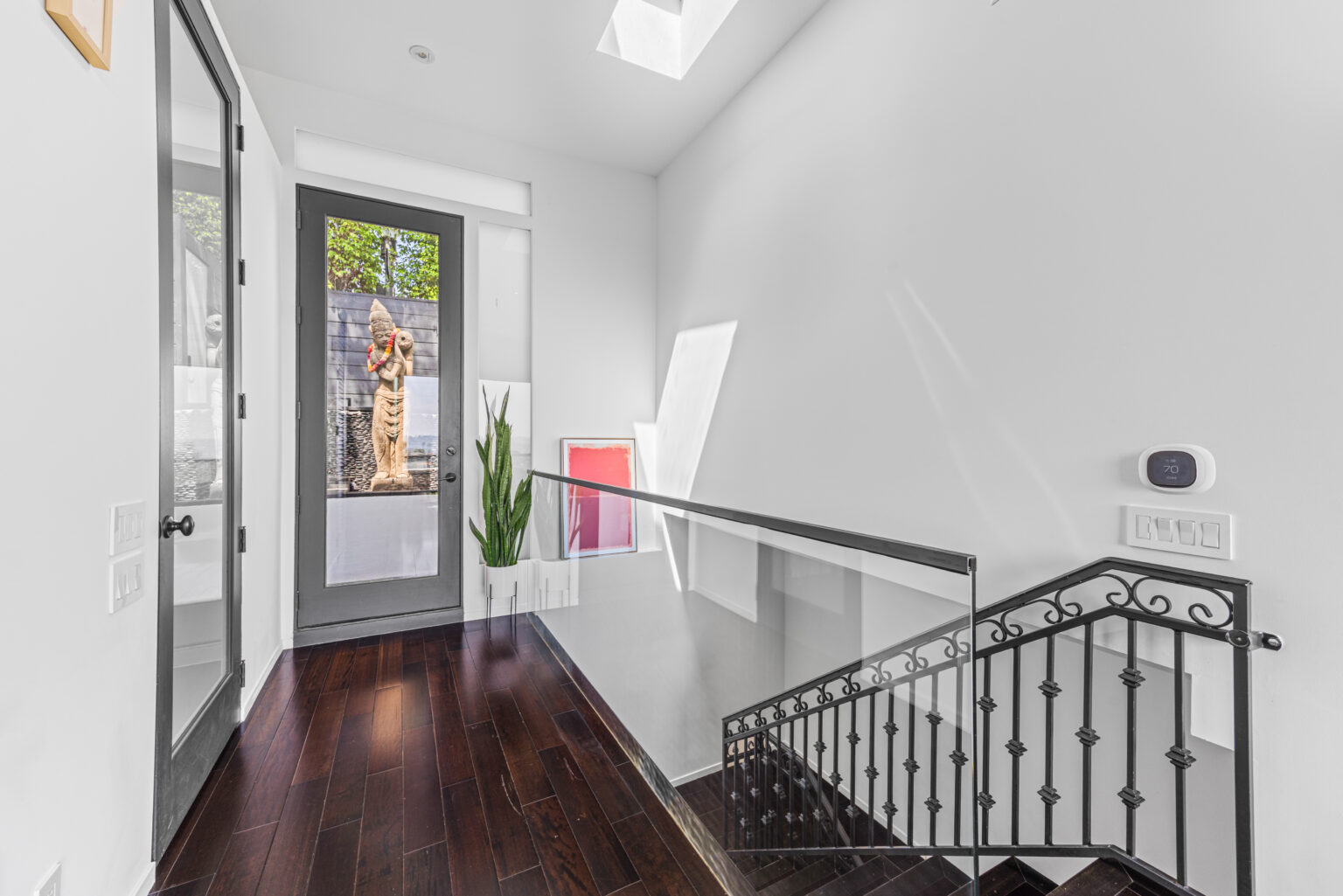 Hallway with skylight and staircase, Southern California real estate.