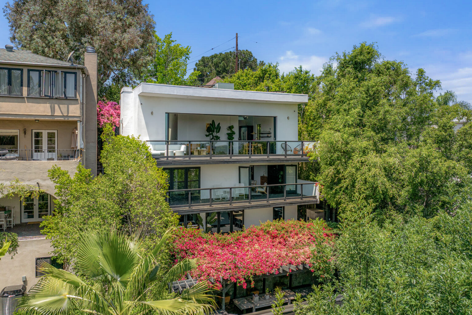 Lush exterior with colorful garden, Southern California real estate.