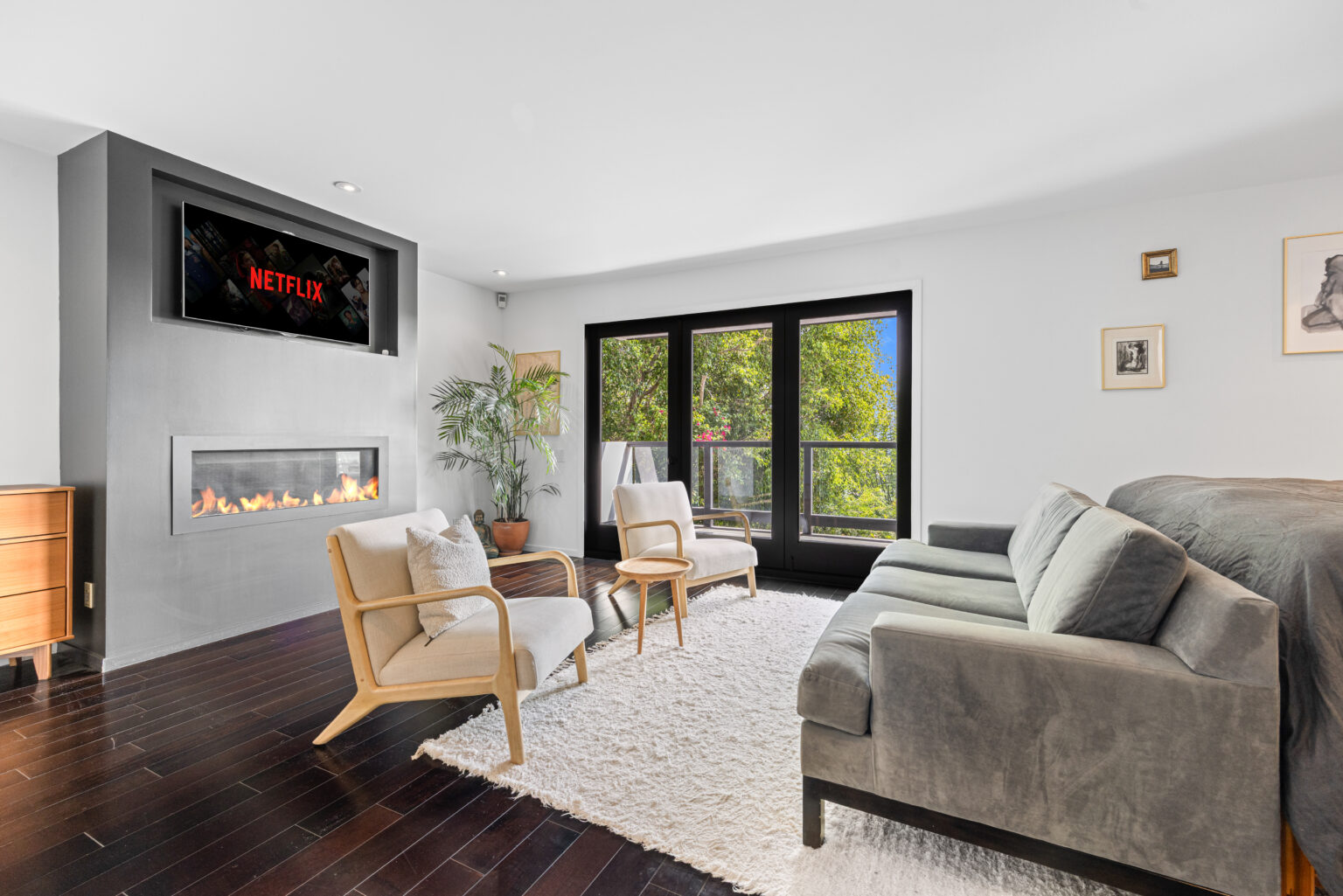 Stylish lounge with patio access, staged by LA real estate photographer.