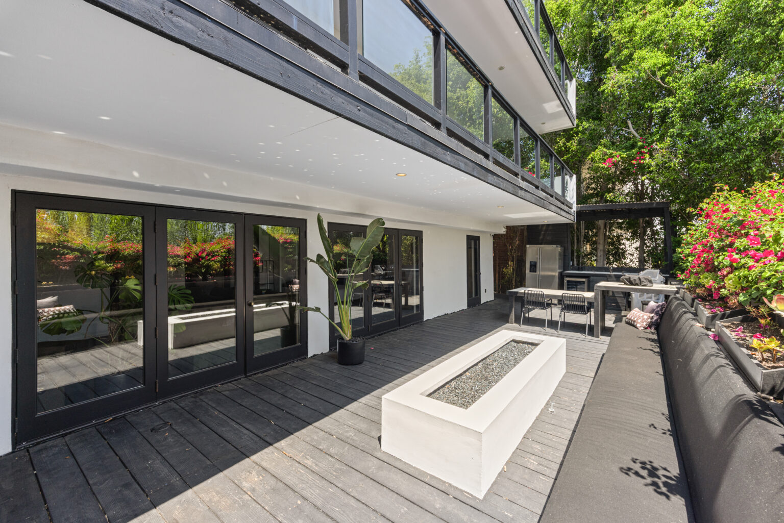 Covered outdoor seating area next to modern building