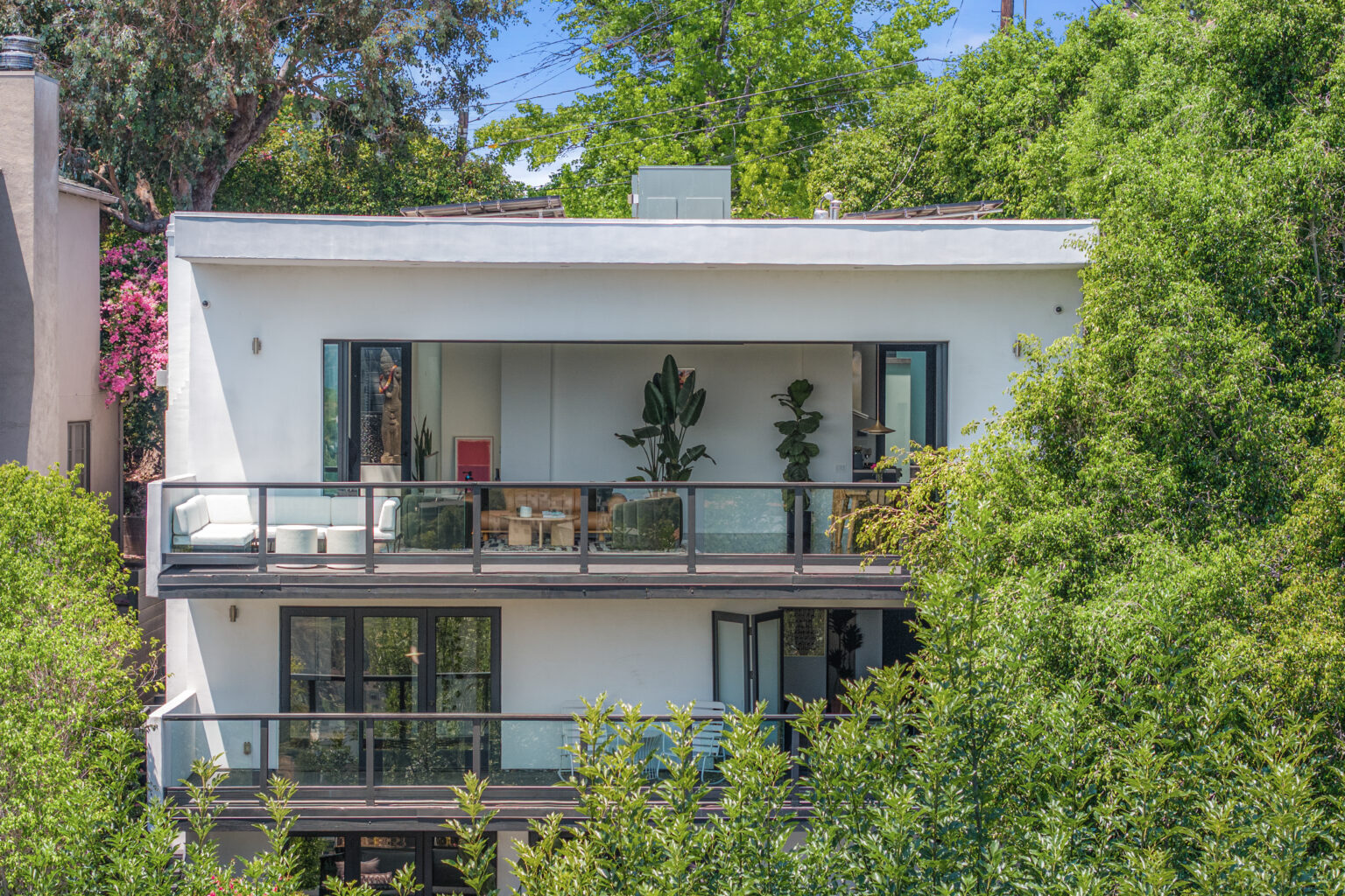 Modern balcony with patio seating, San Fernando Valley home.