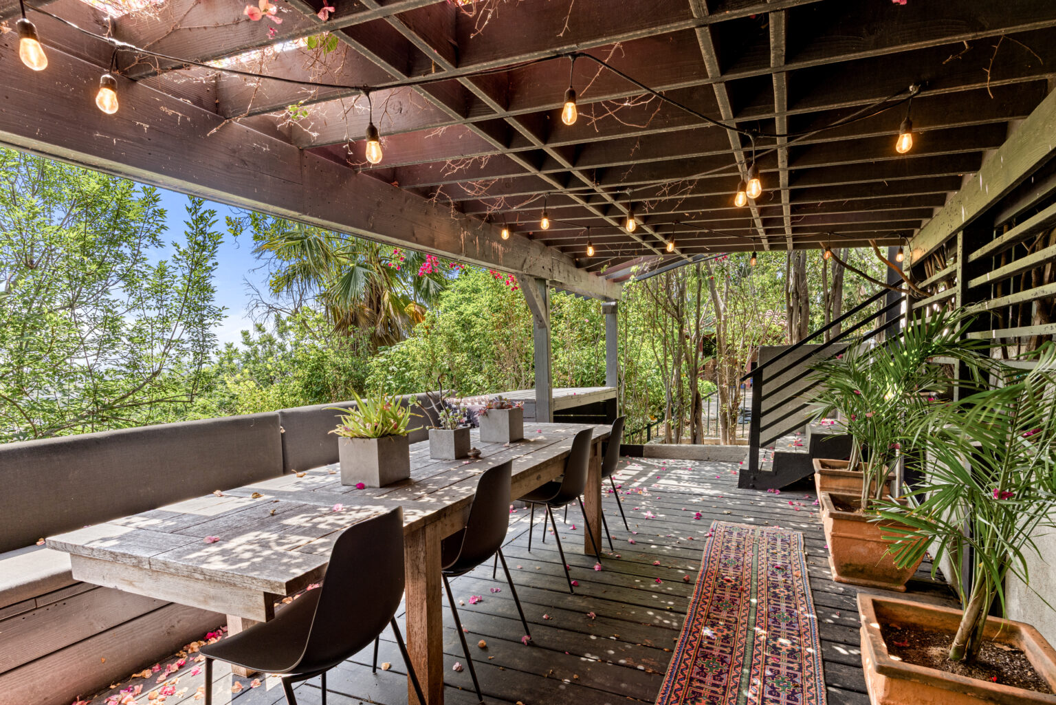 Outdoor dining patio with string lights and tables