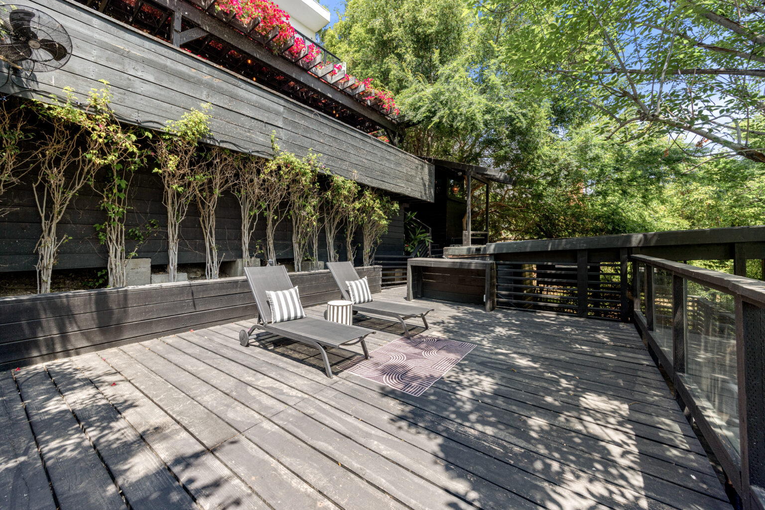 Outdoor patio with seating area under trees