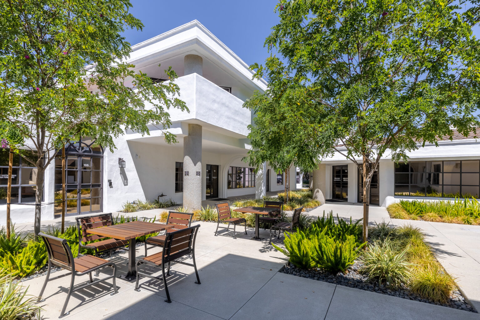 Outdoor plaza area with benches and trees