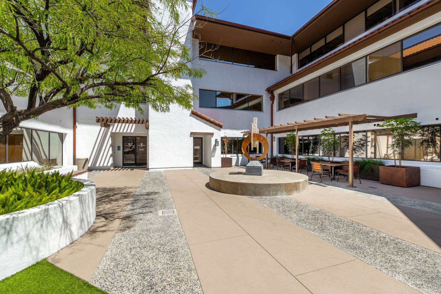 Outdoor courtyard with seating and trees