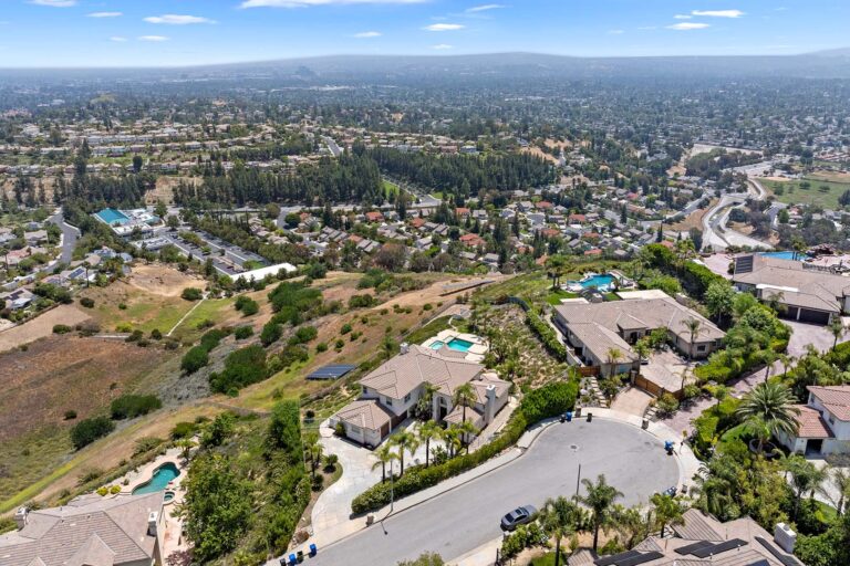 Aerial shot of hillside neighborhood of West Hills with Calabasas and the San Fernando Valley in the background.