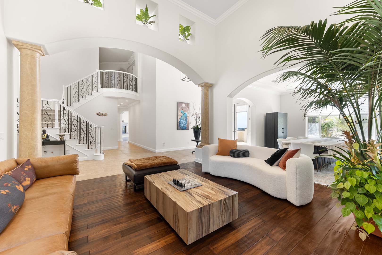 Same living room showing spiral staircase view