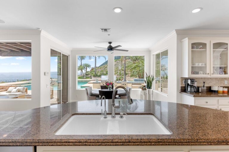 Kitchen island and dining nook with window view