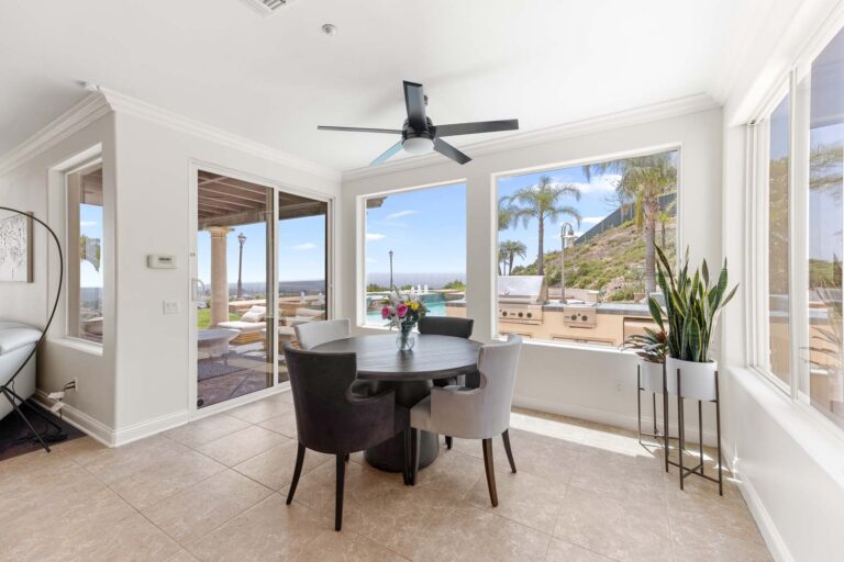 Long view of kitchen with island, cabinets, and open layout