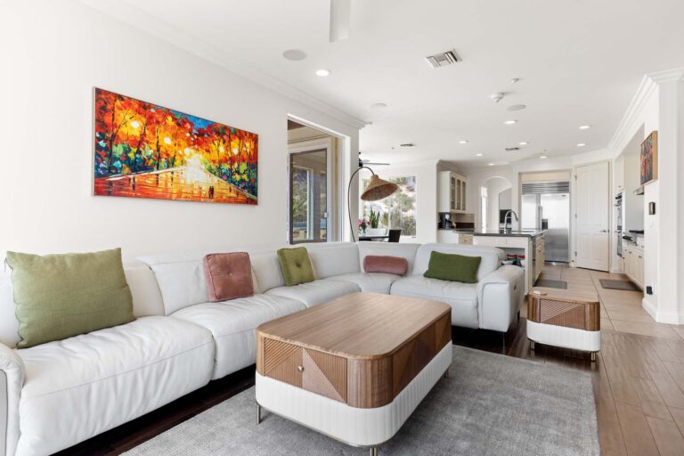 Same living room from another angle, showing hallway