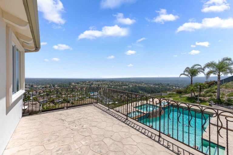 Infinity edge pool with glass railing and view
