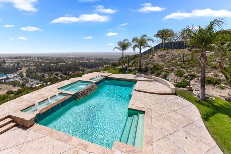 Pool with spa overlooking hillside view of the San Fernando Valley.
