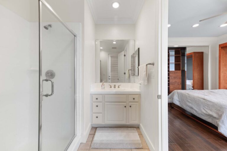 Bathroom shower stall and vanity with mirror