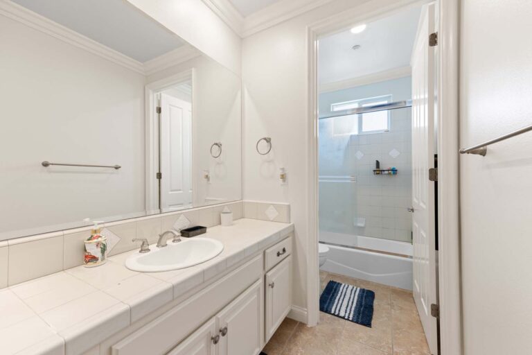 Bathroom with double vanity and glass shower