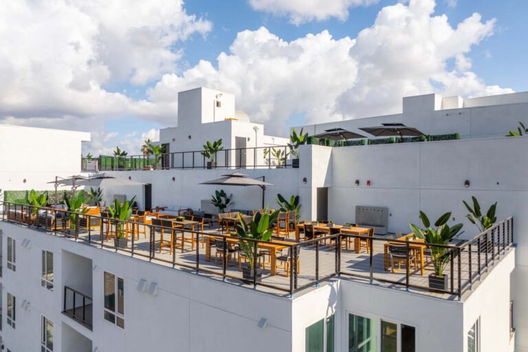 Rooftop patio with outdoor seating and city view